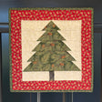 MagneQuilt Evergreen Tree mini quilt with a green pieced tree, cream background, and red holiday border.